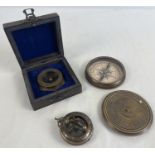3 metal cased naval compasses. A large brass cased compass with screw top lid featuring a