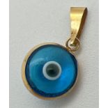 A small 14ct gold and glass "All Seeing Eye" pendant/charm. Bale has worn gold mark, tests as 14ct
