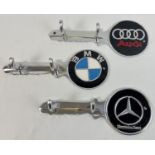3 aluminium wall hanging key hooks with painted car logo detail. Each approx. 30cm long.