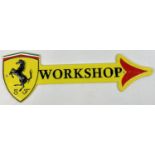 A wall mountable painted cast iron garage workshop arrow with Ferrari logo. Painted in yellow,
