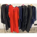 A collection of 6 priests and academic gowns in black, blue and red. To include examples by A. R.
