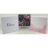 3 empty cosmetic/accessory boxes to include Dior. One plain white two with floral decoration.