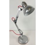 A vintage chrome metal angle poise lamp with angled head. Replacement baize to base. Fully