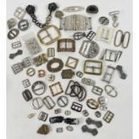 A collection of approx 60 vintage metal buckles and dress clips in varying sizes and designs. To