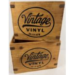 2 modern wooden Vintage vinyl crates with printed advertising to sides, metal banded corners and cut