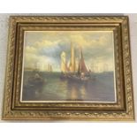 An antique gilt framed and glazed oil painting of ships and boats in a seascape scene. Indistinct