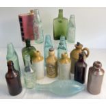 A collection of 17 assorted vintage glass and stoneware bottles. To include codd bottles, torpedo