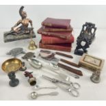A box of assorted vintage items to include poetry books, soapstone items, brass items and marble