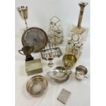 A box of assorted vintage silver plated items to include cut glass cruet sets and stands, small