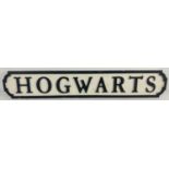 A modern painted wood sign for Hogwarts, in the style of an old street sign. Approx. 78cm long.
