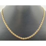 A 16 inch 9ct gold decorative curb chain necklace with lobster claw clasp. Hallmarks to clasp and