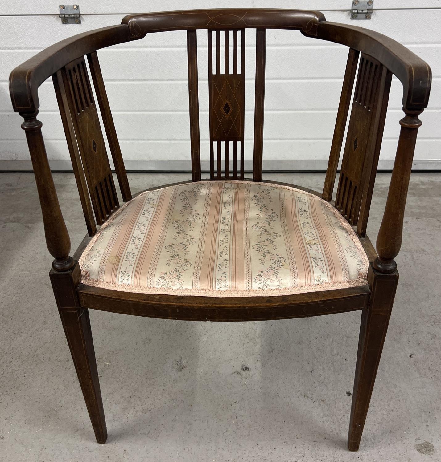 A Victorian dark wood curve backed chair with spindle supports and inlaid detail to panels and back.