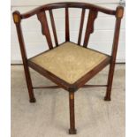 An Edwardian mahogany corner chair with satinwood inlaid detail to legs & back spindles of a