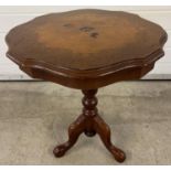 A vintage ornate tripod occasional table with inlaid floral design to top and shaped rim. Approx.