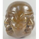 A brass paperweight of a 4 faced Buddha, with impressed signature mark to underside. Approx. 11cm