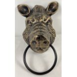 A bronzed effect painted cast iron wall hanging Boar head with metal ring. Approx 18cm tall (not inc