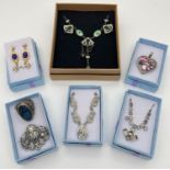 A collection of vintage and modern boxed costume jewellery. To include stone set necklaces and a
