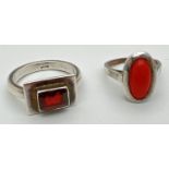 2 silver dress rings. A modern design set with a singular rectangular cut garnet and a vintage