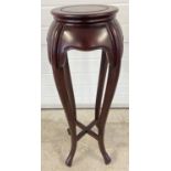 A vintage Oriental style hardwood jardiniere stand with circular shaped top and cabriole style
