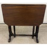 A small antique dark wood Sutherland style drop leaf table with turned detail to legs. Gateleg