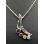 A silver and multi stone set pendant necklace on an 18" silver thick rope chain. Modern contemporary