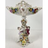 A vintage porcelain comport with decorative figural and floral applied detail and open pierced