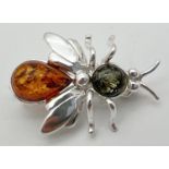A small 925 silver and amber brooch modelled as a bee, stamped 925 to underside and with makers