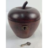 A Georgian style wooden tea caddy in the shape of an apple, with hinged lid. Complete with key,