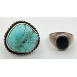 A vintage silver signet ring set with an oval of black onyx. Together with a modern design white