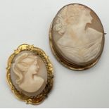 2 vintage cameo brooches, one in gold plated decorative mount. Largest approx. 4.5cm x 3.5cm.