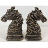 A pair of bronze effect cast iron horse head figures. Each approx. 24cm tall and weighs 2.1kg.