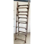 A large vintage wood folding trestle, ideal display item. Approx. 220cm tall x 66cm wide.