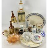 A box of mixed vintage ceramics to include Bell's whiskey empty decanters by Wade, a Poole floral