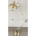 A new and unused brushed gold metal floor standing anglepoise standard lamp. Complete with