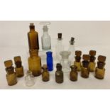 17 miniature clear and coloured glass bottles, some with stoppers. To include a vintage W.D.