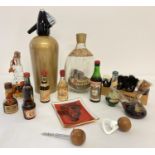 A small collection of vintage breweriana. To include vintage miniatures, a Boc soda syphon and a