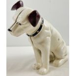 A large painted cast iron money bank of the HMV dog. Approx. 25.5cm tall and weighs approx. 4.5kg.