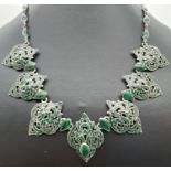 A vintage Siam silver oriental design necklace with 7 pierced work green enamelled panels. Double