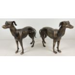 A large pair (male & female) of bronzed effect cast iron greyhound figures. Each approx. 29cm tall x