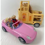 A Barbie horse trailer with horse together with 2 barbie dolls & a Thinking Toy convertible sports