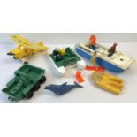 A collection of vintage Fisher Price land, air and sea vehicles with some figures and accessories.