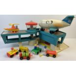 A vintage Fisher Price Airport. With passenger plane, helicopter, luggage carts, cars, figures and