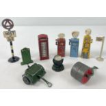 10 vintage diecast vehicle accessories to include petrol pumps, road sign, telephone box, flood