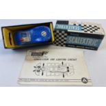 A boxed 1960's Tri-ang Scalextric blue Lister Jaguar MM/E1 racing car with electric head and tail