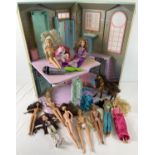 A box of assorted Barbie, Disney Princess & Bratz dolls together with a Barbie folding townhouse.