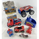 A box of assorted Marvel Spiderman vehicles together with 2 x 1990's Bluebird Toys playsets.