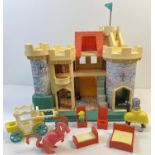 A vintage Fisher Price Castle play set with figures and accessories to include a horse with knight