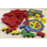 A vintage plastic railway set in bright primary colours. Stamped "Made In Gt. Britain".