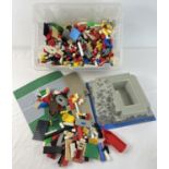 A tub of assorted vintage Lego to include minifigures, base plates and boat.