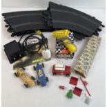 A box of assorted vintage Scalextric track, cars and accessories. To include boxed A265 hand